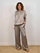 Silken Escape Satin Two-Piece Set with wide-leg pants and fitted top in flowing satin fabric