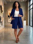 Stylish blazer and shorts two-piece set on white background