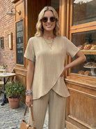 Textured Elegance two-piece set with asymmetrical top and wide-leg pants in soft stretch fabric