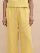 woman wearing loose fit co-ord set with soft-tailored top and wide-leg bottoms in meadow design