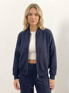 The Voyager Zip Set two-piece zip-front sweatshirt and wide-leg joggers in neutral tones for travel and casual wear