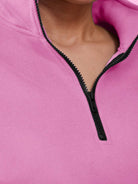 Close-up of pink ultra-soft and comfy co-ord tracksuit set with black zipper detail