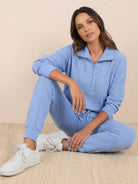 Unisex half-zip pullover and sweatpants set in soft fabric for casual comfort and relaxed fit