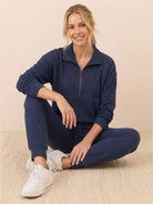 Unisex half-zip pullover and matching sweatpants set in soft fabric for casual comfort