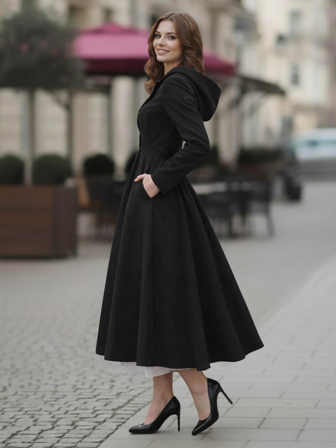 Water-repellent A-line hooded raincoat for women with belt, insulated lining, and elegant dress-like style