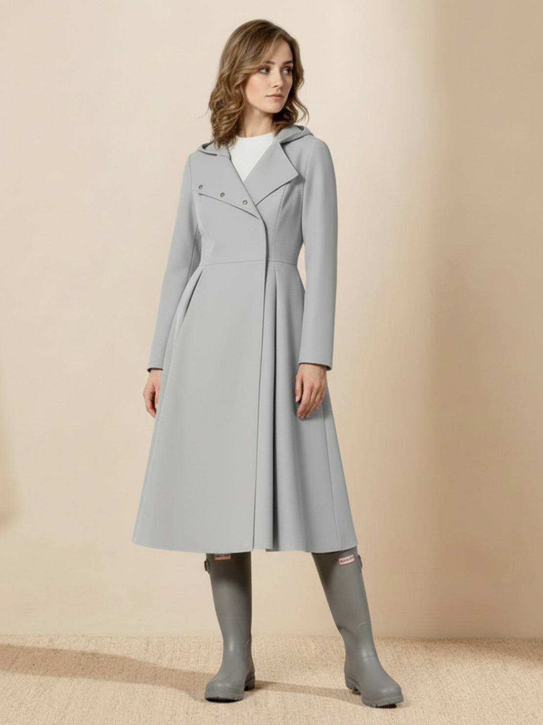 Water-repellent A-line hooded raincoat with belt, insulated lining, and feminine fit for women