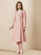 Woman wearing water-repellent A-line hooded raincoat with belt, styled as a dress