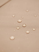 Elegant water-repellent rain A-line hooded raincoat for women with insulated lining and matching belt