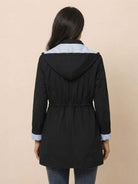 Women's black water resistant windbreaker jacket with hood and striped lining back view