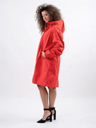 Water-resistant oversized hooded windbreaker rain jacket with multiple pockets and packable design